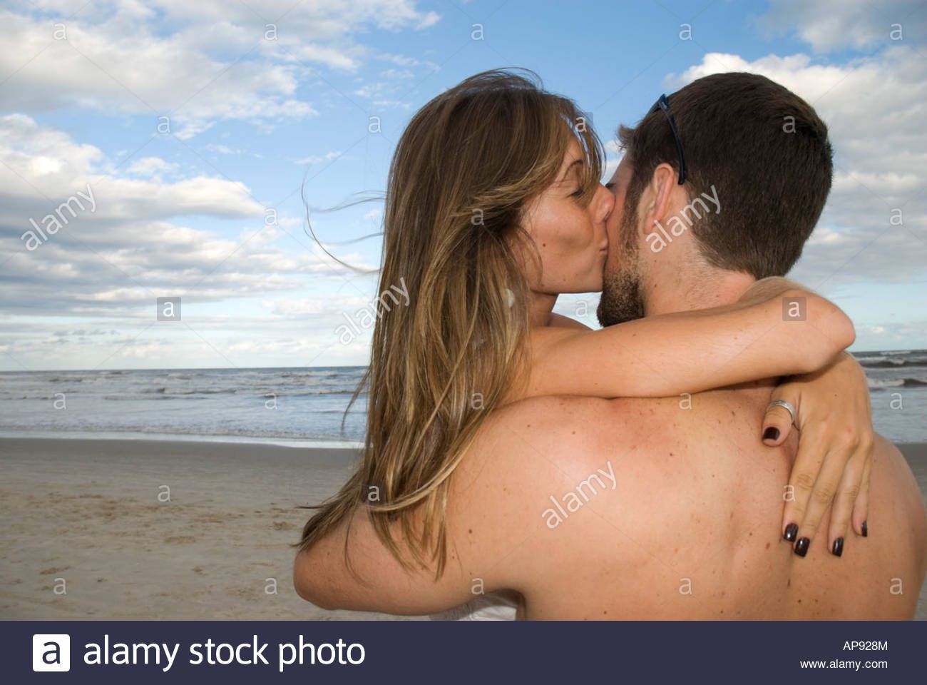 A naked man kissing naked girl